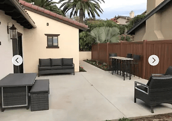 Abundantly sunny, outdoor patio with grill, fire pit, and furniture