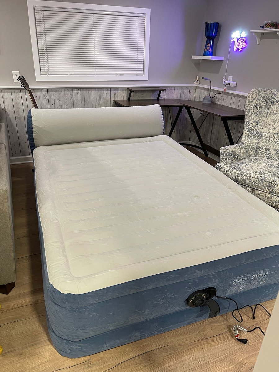 Blow up air queen mattress with headboard. Inflates and deflates in minutes. Stored in cabinet in kitchenette. Extra bedding upstairs in linen closet.
