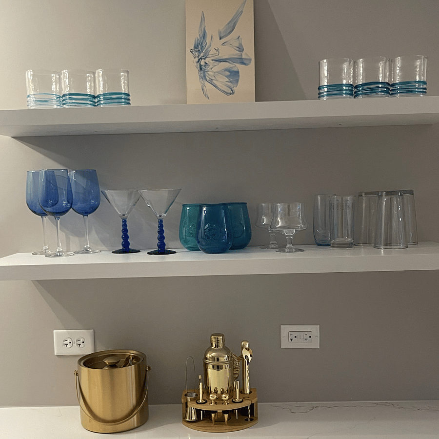 The blue fairy watches over the bar ware.