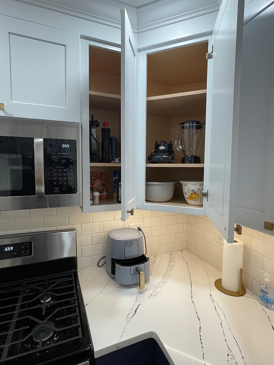 kitchen with airfryer, blender, crockpot, waffle maker.