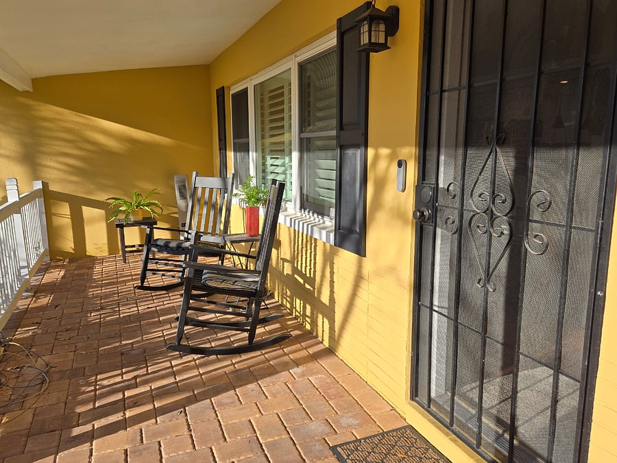 Front porch with rocking chairs and fan