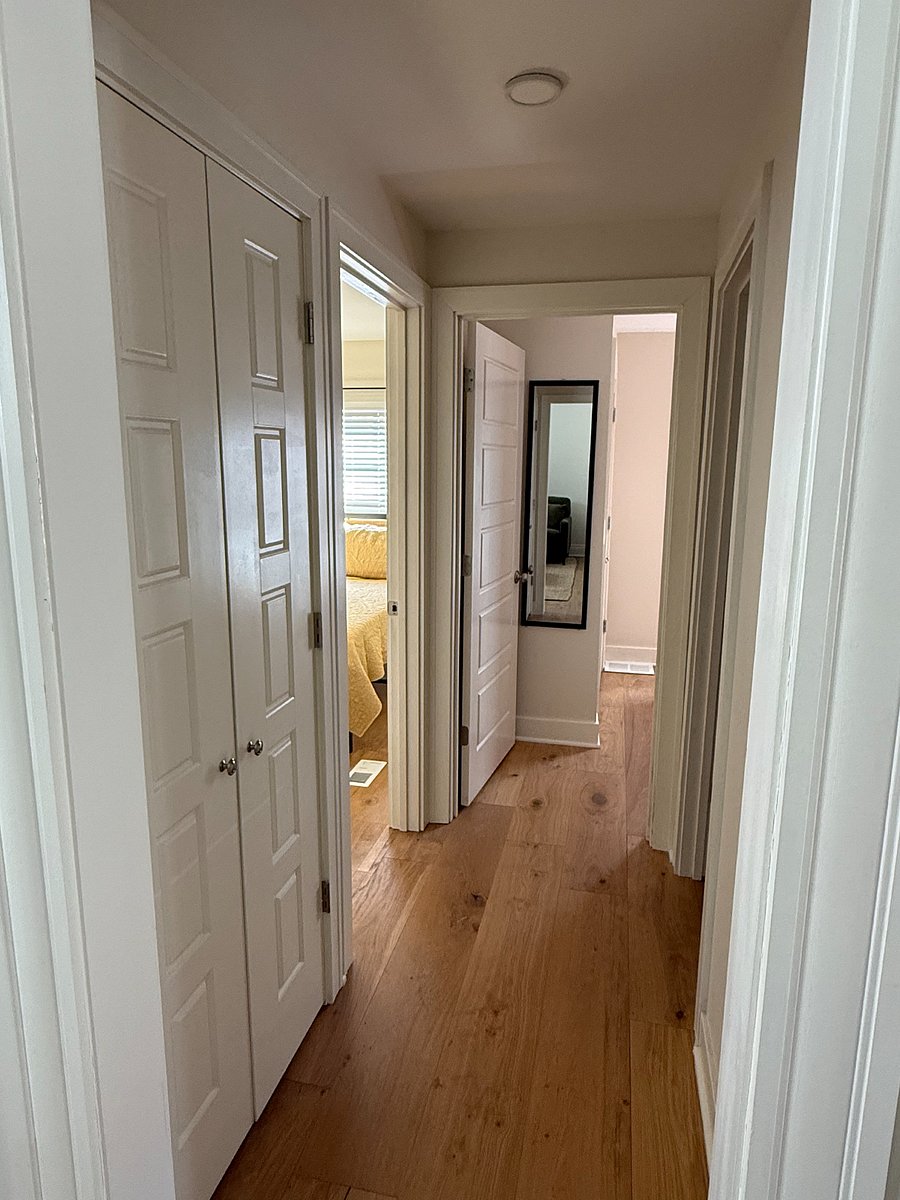 Hall to bedrooms- laundry closet on the left and bathroom on right.