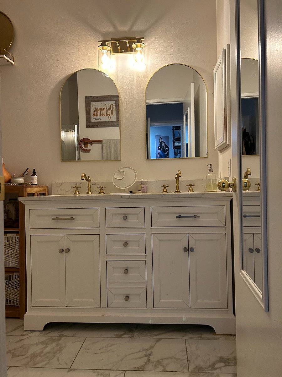 Main attached bathroom w/standing shower-full his/her sinks and brushed brass vintage faucets.