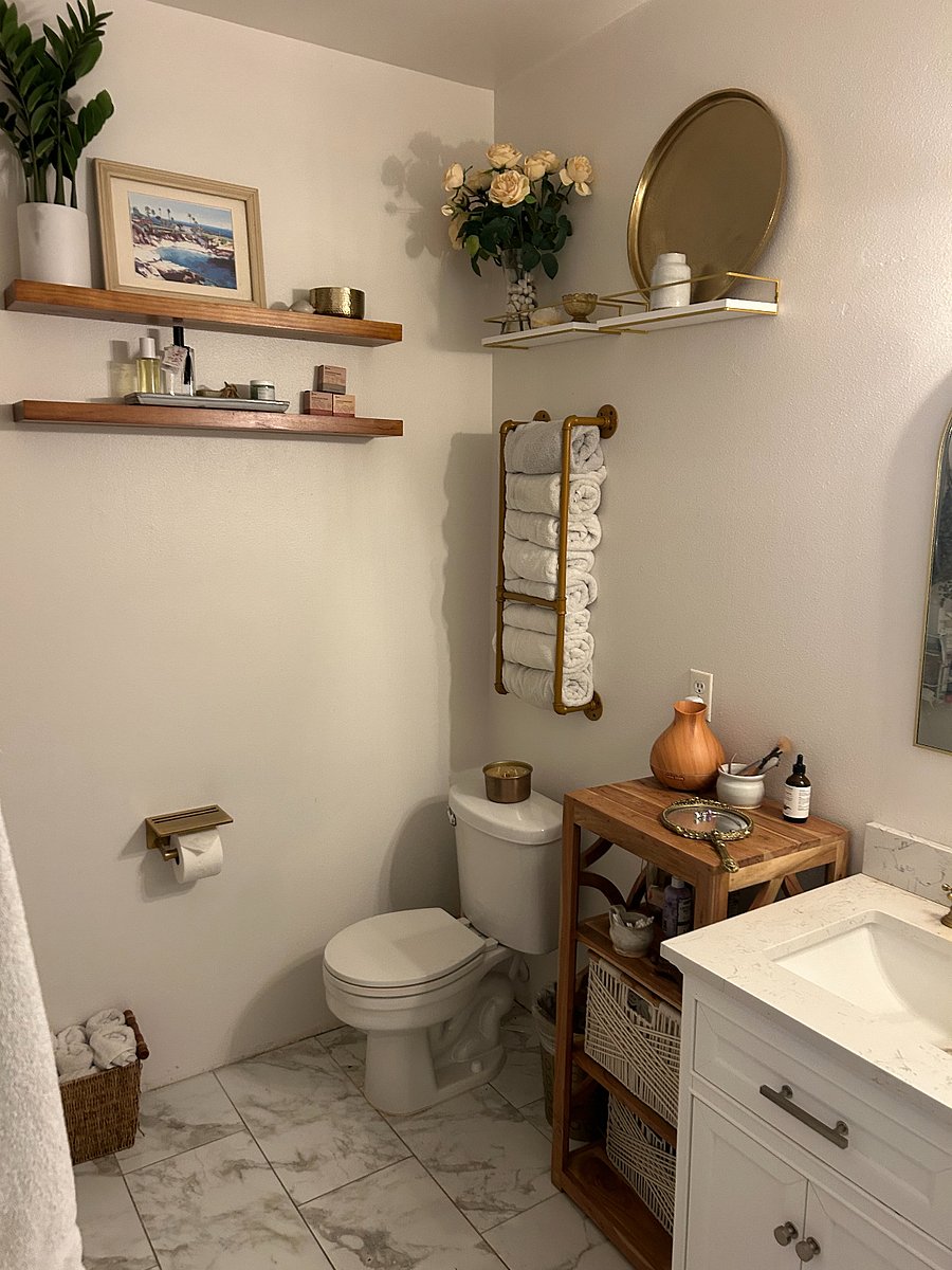 Main attached bathroom w/standing shower w/warm wood and brass accents