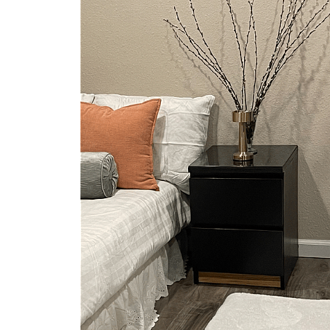 Downstairs bedroom has a queen bed .