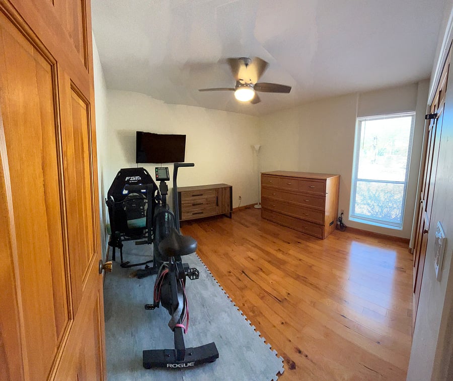 Third bedroom with Murphy cabinet bed and exercise bike