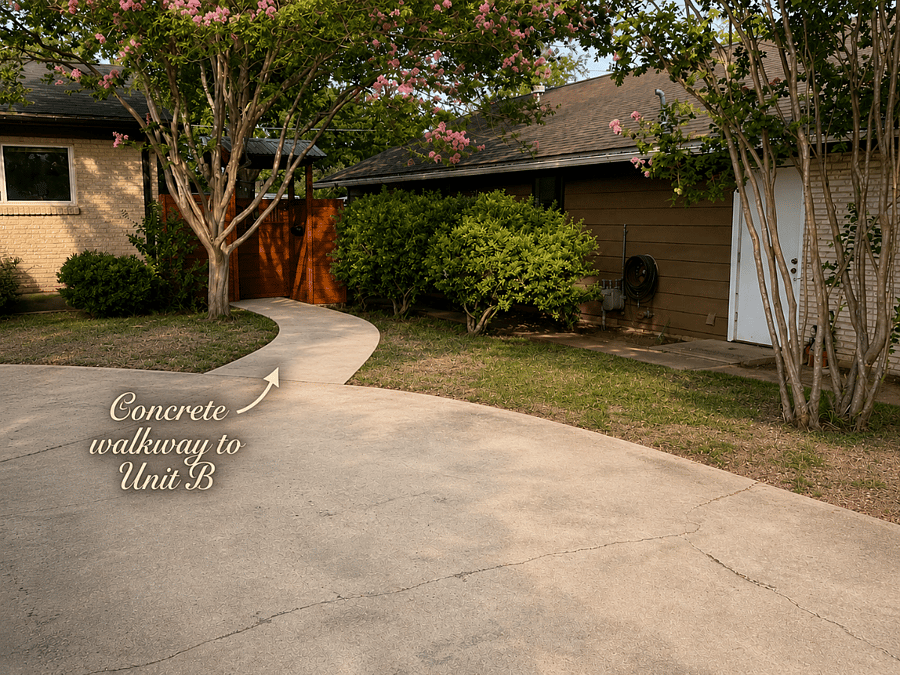 Concrete sidewalk from the driveway to the front door.