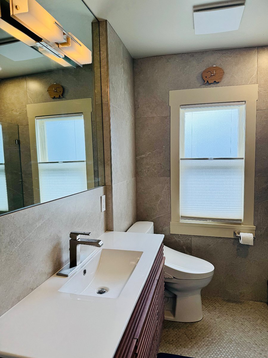 Full bath complete with soaking tub heated flooring, heated toilet with bidet and a second stacked washer/dryer set. One set in the remodeled basement the other in this bathroom upstairs