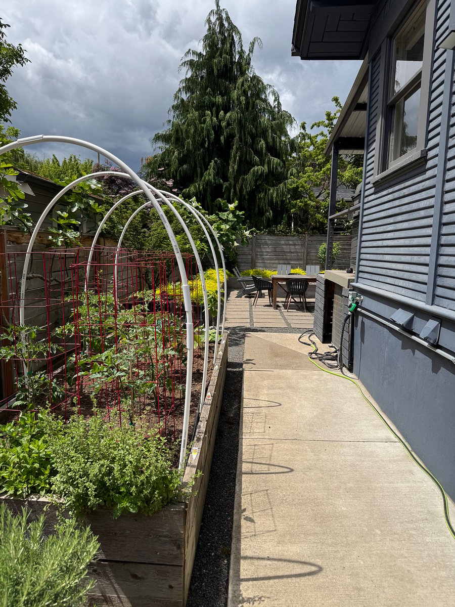 Enter the southern gate to the raised vegetable beds and the side exterior entrance with keyless entry.