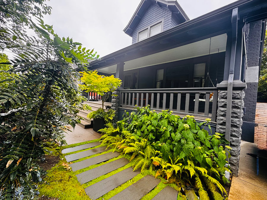 Front of the house with huge front porch and porch swing
vibrant green colors