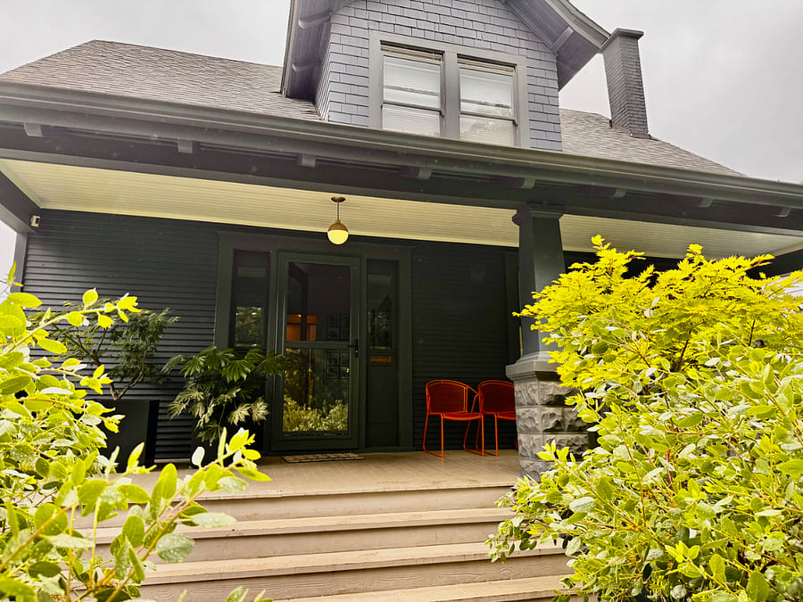 Front of the house with huge front porch and porch swing