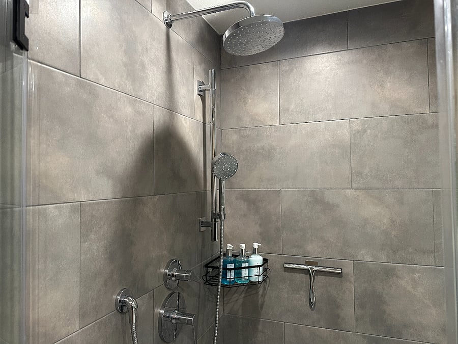 Featuring a dual rainfall and handheld shower heads.