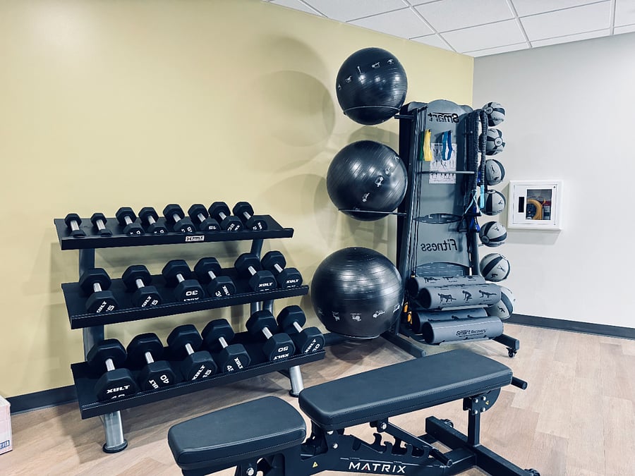 Free weights with squat and bench rack (not shown) plus yoga equipment