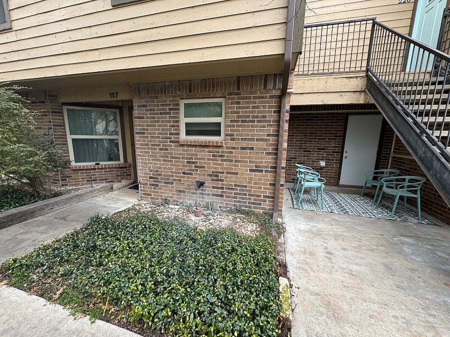Outdoor patio with furniture just outside the front door with walk-in private storage closet