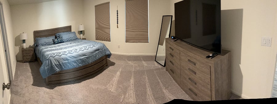 Primary bedroom with King bed, two night stands and one fullsize dresser. Smart TV. Full length mirror.