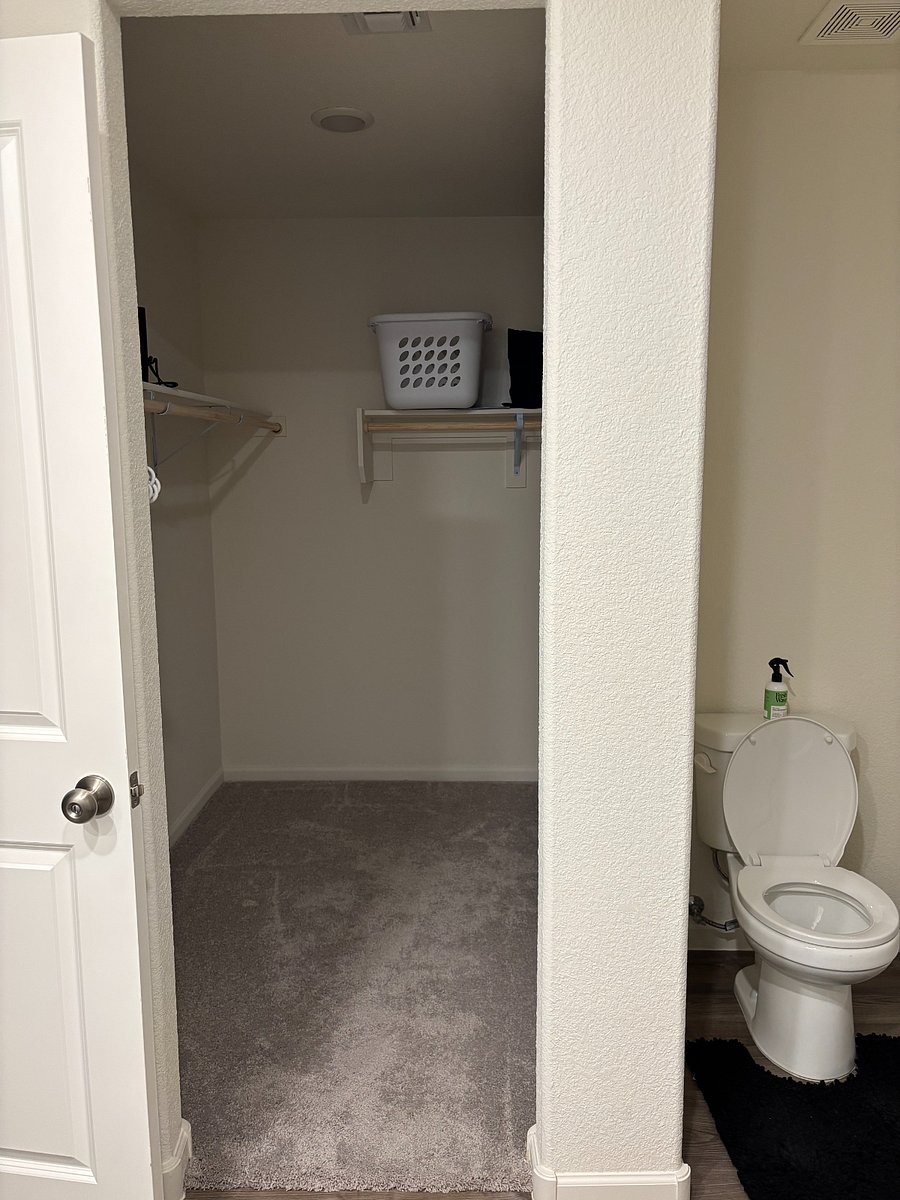 Primary bedroom - walk-in closet connected to bathroom.
