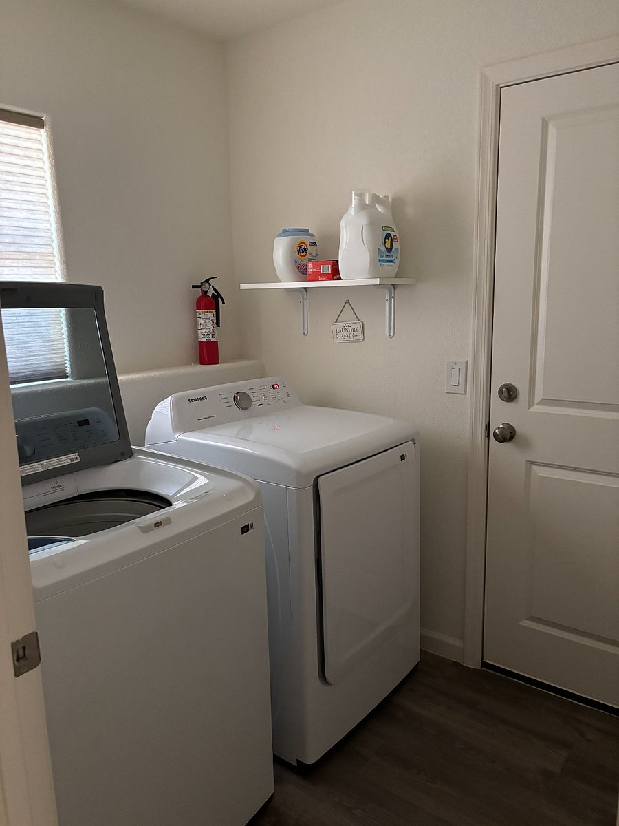 Indoor laundry - new washer and dryer. Entry from garage into laundry room inside of home.