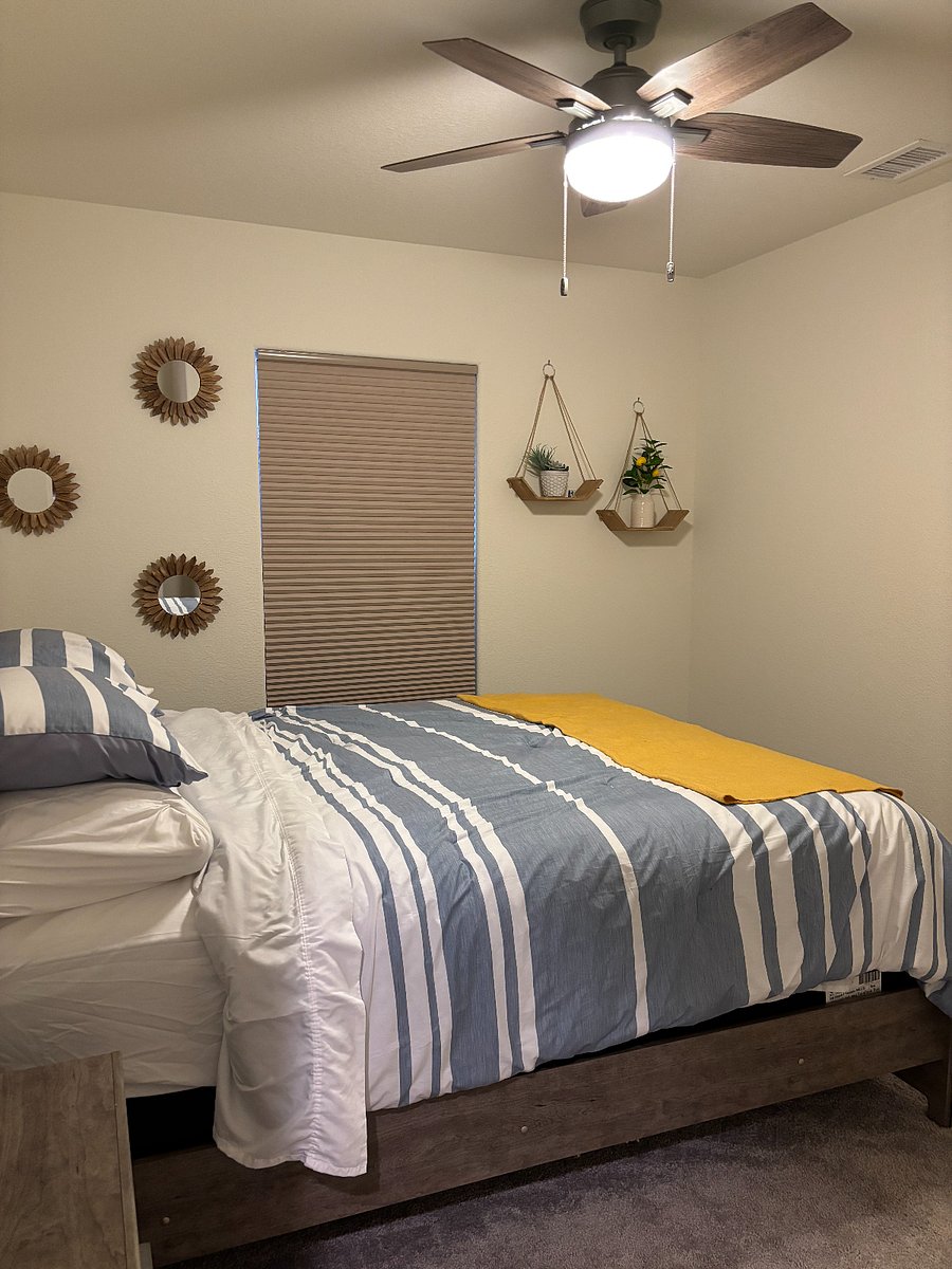 3rd bedroom with Queen bed and one night stand. Ceiling fan.