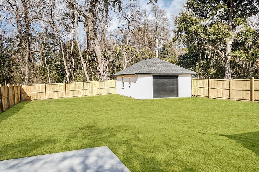 A spacious and secluded backyard! Fully fenced for privacy, making it the perfect spot to unwind, enjoy the outdoors, or let your furry friends explore freely. 