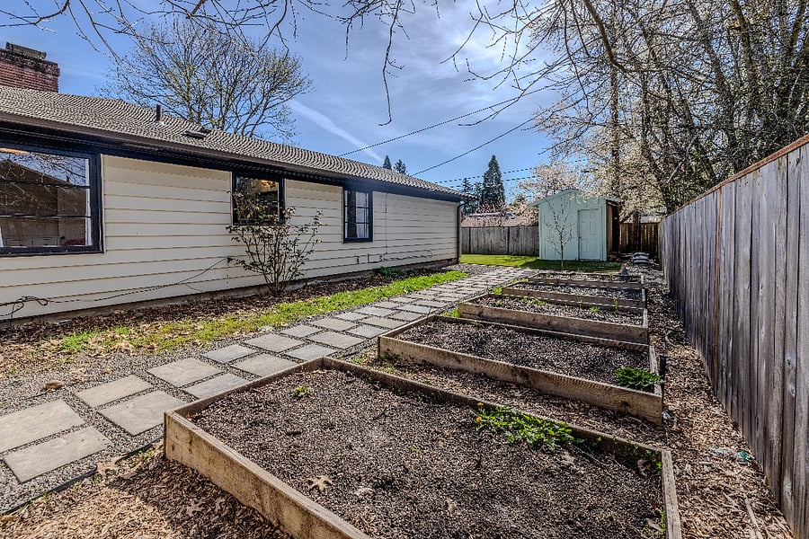 Raised garden beds and paver path
