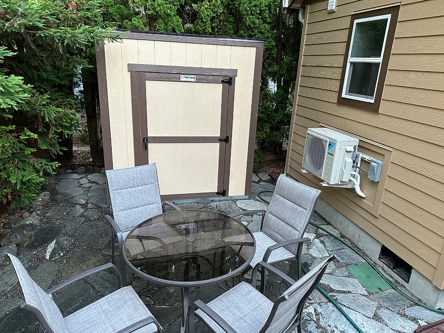 Storage shed, outdoor table and chairs