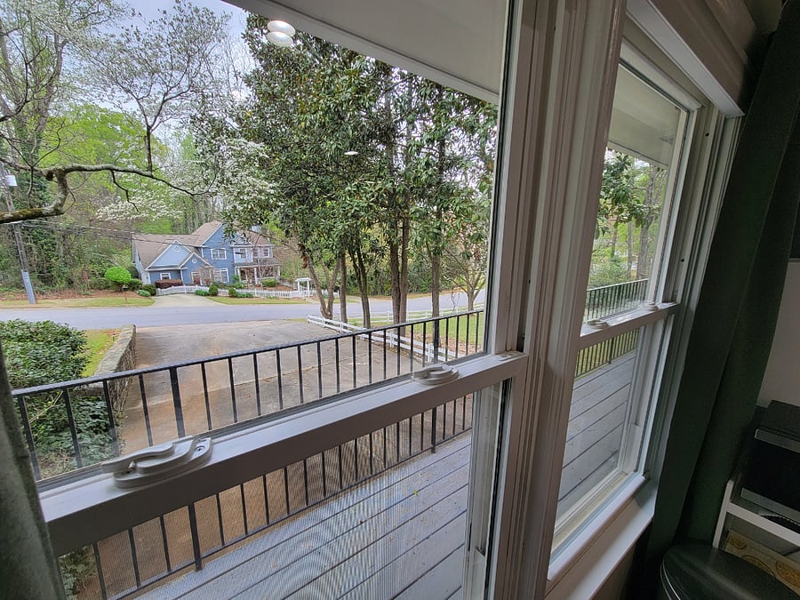 Overlooking driveway/parking toward neighbors home across the street.