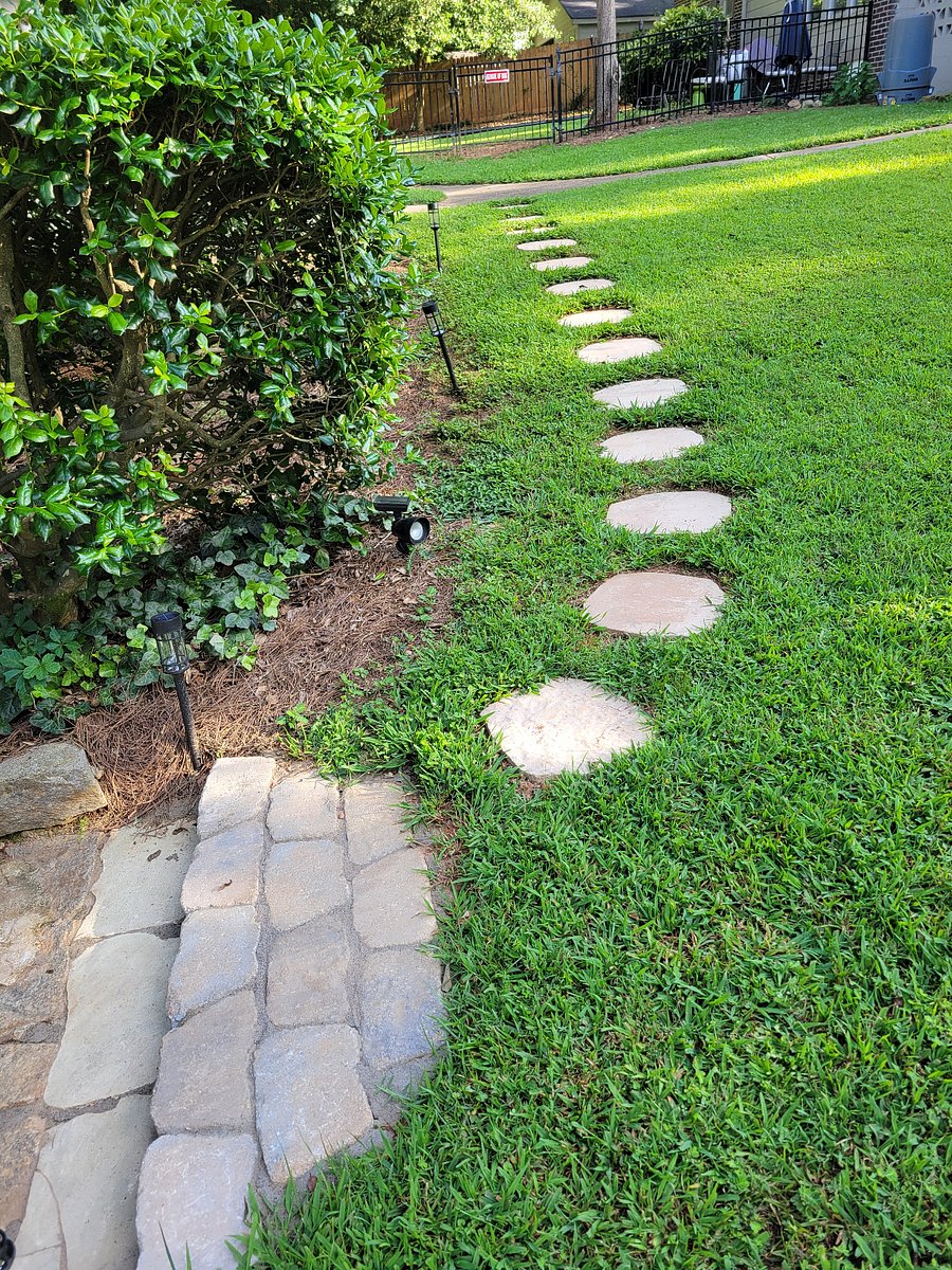 sloping stepstone path leading to main entrance