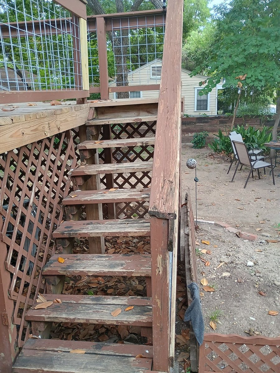 Steps to back porch of the main house and shared washer/ dryer room.
