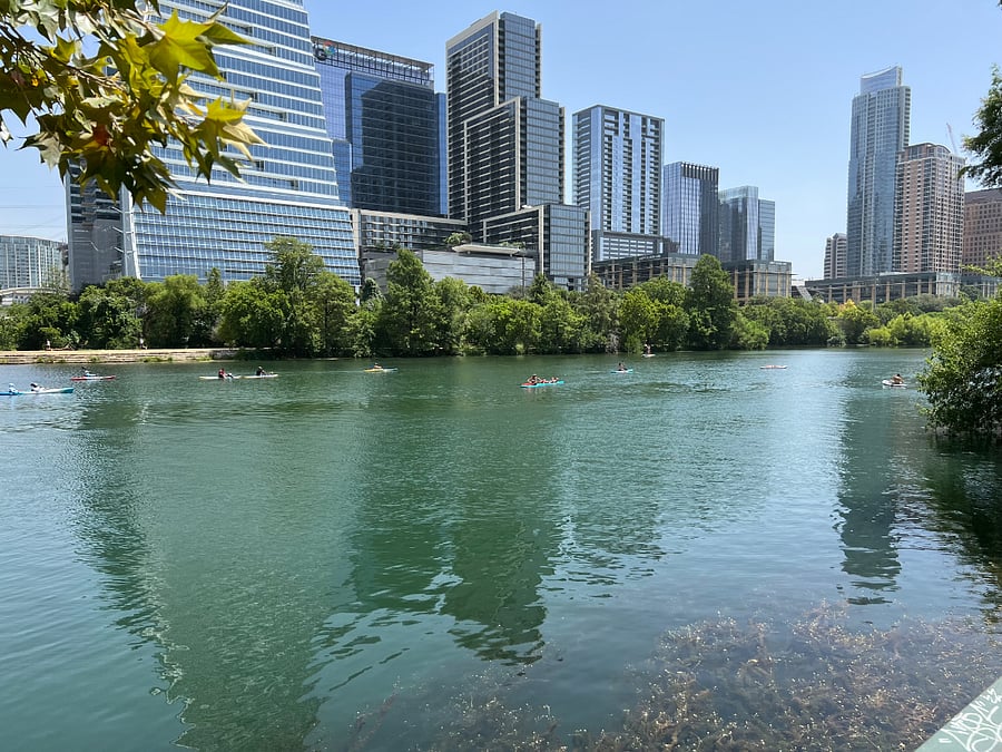 The Lady Bird Lake, a mile north, is filled with kayak's, paddle boards and other paddling vessels that are available to rent at locations along the trail.