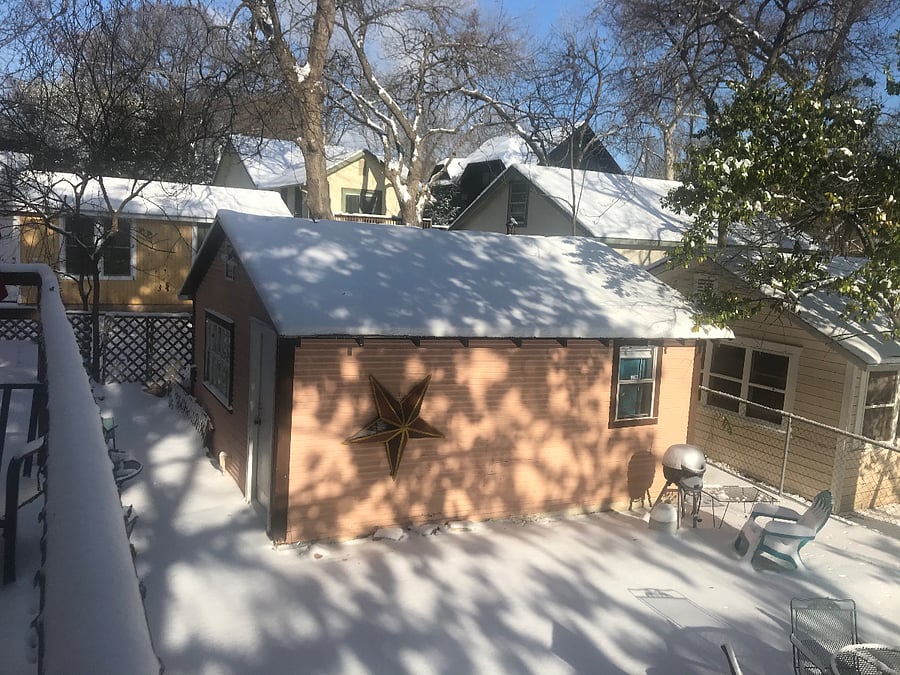 The cozy Little Pink House in a winter wonderland.