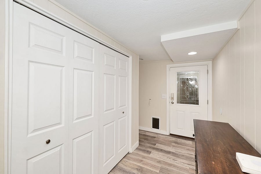 Inside entry. This area boast a HUGE closet for coats or gear! Hangers and storage available in this space.