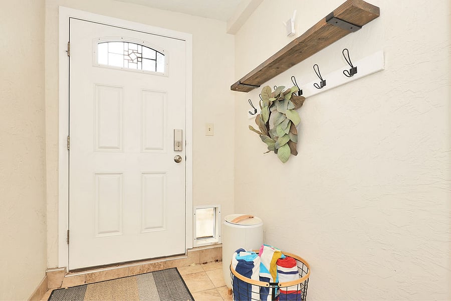 Covered entry from back yard. This area is like a mud room. There are towels for the hot tube and a towel warmer. A good area to leave skis or outdoor equipment.