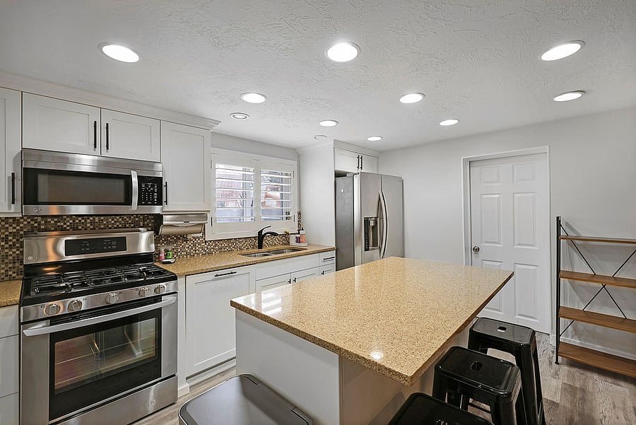 Full kitchen that flows into open area for dining and family room. LG appliances: Gas oven/range, microwave, refrigerator/freezer with ice maker and water. Kitchen has all the basic needs and some extras! Pots/pans, dishes, baking pans, kitchen aid mixer, blender, stick blender, utensils, plates, bowls, serving bowls, smaller containers for storing left overs! If there is anything you need not listed just let us know...we most likely have it available!
