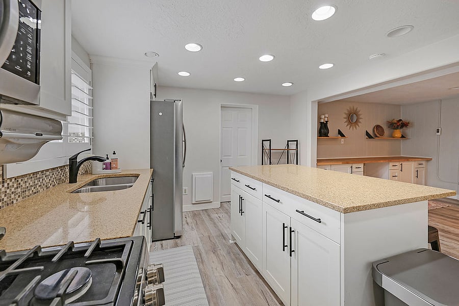 Full kitchen that flows into open area for dining and family room. LG appliances: Gas oven/range, microwave, refrigerator/freezer with ice maker and water. Kitchen has all the basic needs and some extras!