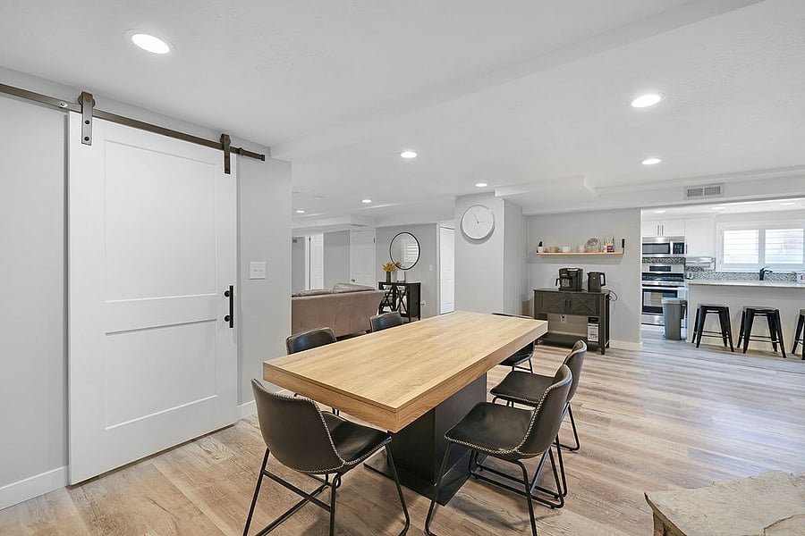 Dining, kitchen and family room flow together. Seating at table 6. Seating at island in kitchen, 3-4 (there is another bar stool in the store room). Also available are additional folding table and chairs if needed.
