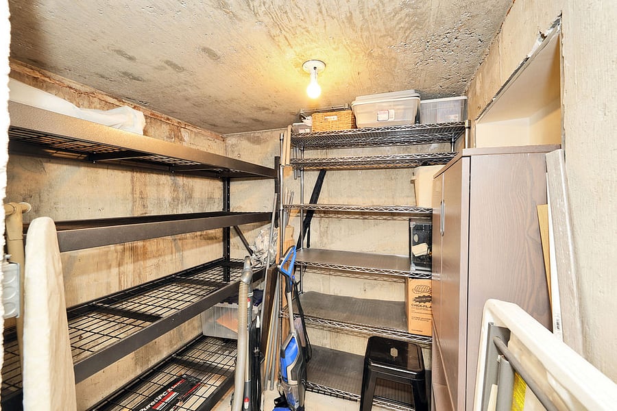 Storage area with multiple open shelves for your "stuff"! Also stores the extra folding table, ironing board, iron, vacuum and cleaning supplies. There are extra office supplies in this area if you need some paper, envelopes, paper cutter etc.
