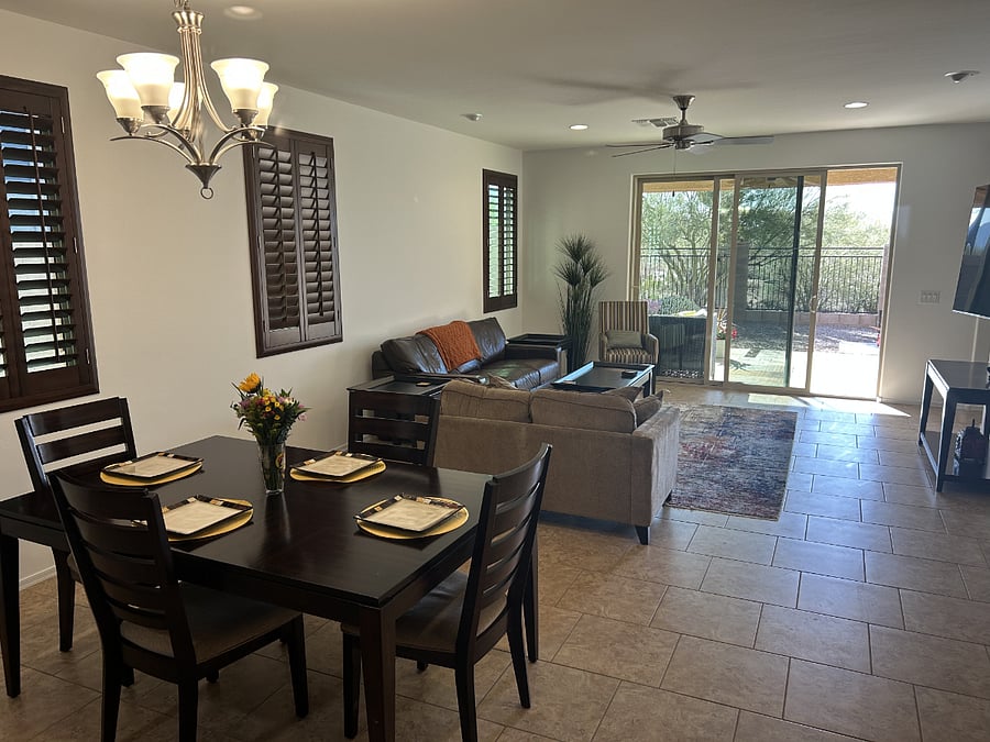 View from end of kitchen out to the fully retractable sliding door to the gated back yard and native
