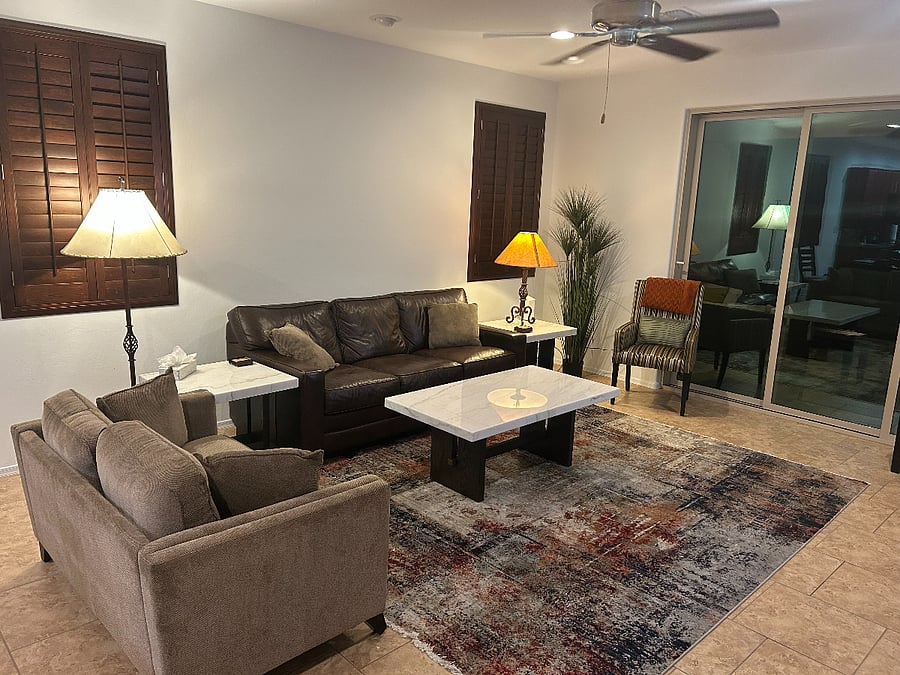 Living room with sleeper sofa and 75" new Samsung smart tv