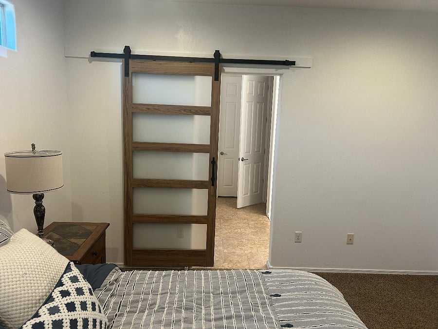 Barn door providing privacy between master bedroom/bath/shower/closet for both early risers and blessed sleepers...