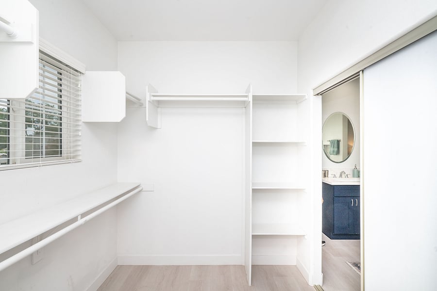Master bedroom walk-in closet from bathroom
