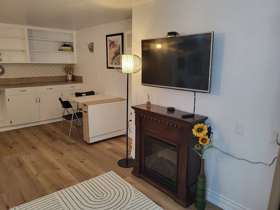 The electric fireplace under the TV provides ambience. Note: the chairs have been upgraded; new photos coming soon.