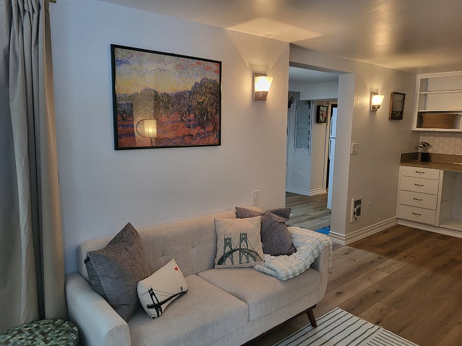 Living room looking into kitchen area.