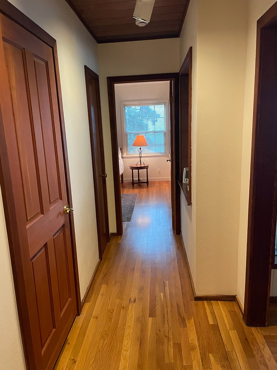 Upstairs hallway to each of the bedrooms. Window with fantastic view to the west.  On weekend mornings look to the west for hot air balloons rising down the valley. 