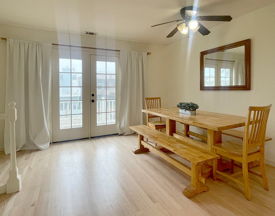 Light & Bright Dining Area With French Doors Leading To Ocean View Deck