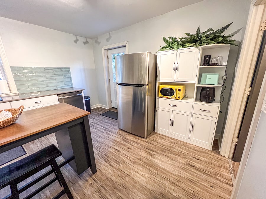 Kitchen space with pantry storage, full size kitchen appliances, kitchen basics.