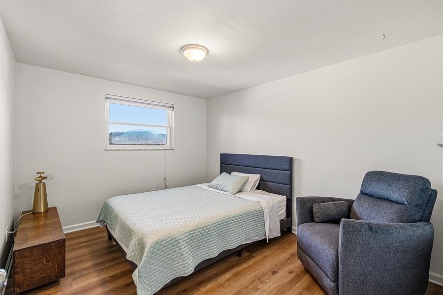 Bedroom 3: Queen Bed, swivel armchair, full closet