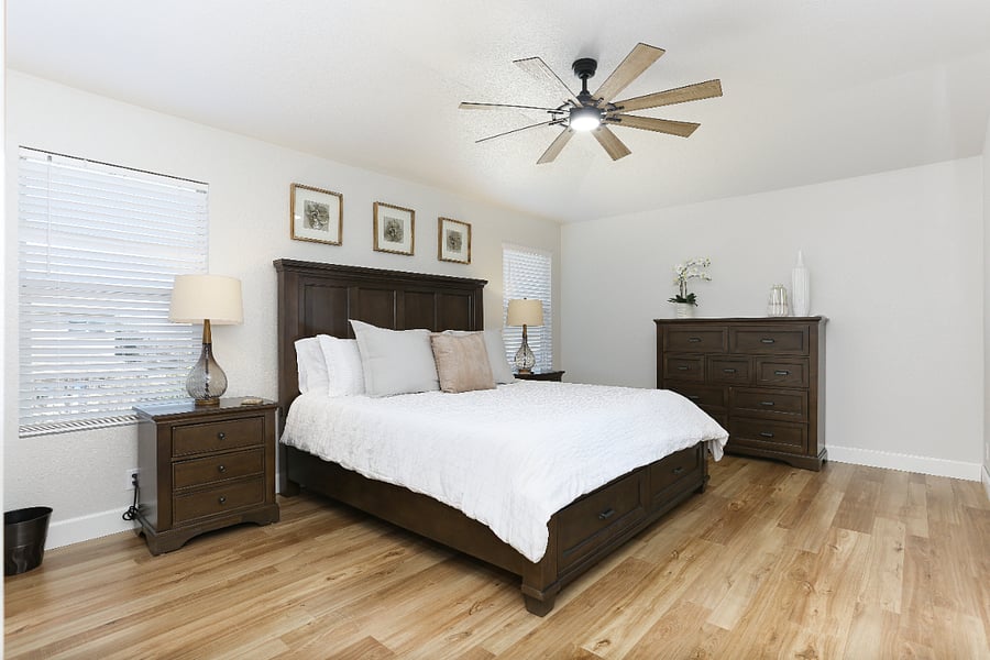 Room #5 The Master Bedroom: a spacious retreat boasting a luxurious king-size bed with exceptionally comfortable linens. Enjoy the convenience of your own en-suite bathroom and walk-in shower, making this a hotel-quality experience elevated by the warmth and privacy of home.