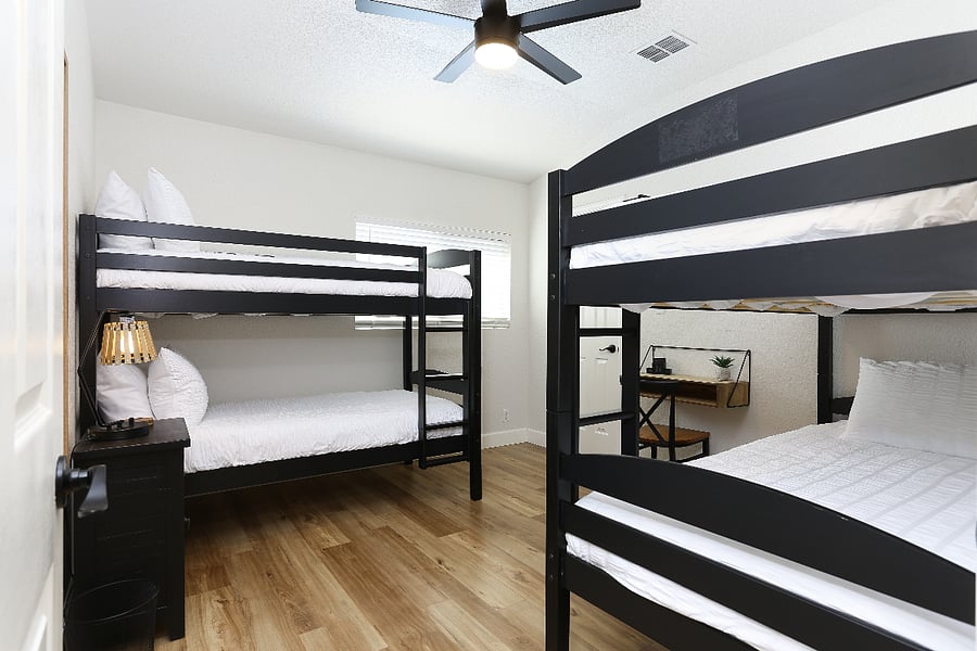 Room #4 this spacious room features two bunk beds, comfortably accommodating up to four guest, ideal for traveling professionals or roommates. While there's no TV in the room, guest have access to a large shared TV in the upstairs second living room, offering a cozy spot to unwind. 