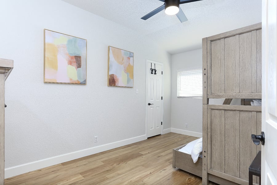 Room #3 upstairs it's perfect for families or groups, featuring a bunkbed with a trundle, comfortably accommodating up to 3 people. It's practical and cozy space design for a restful stay.