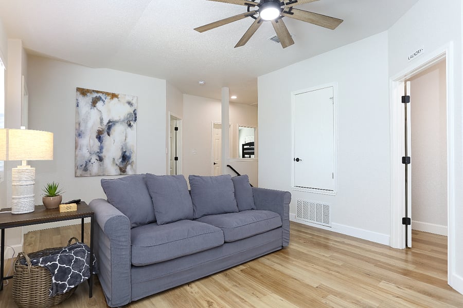 Upstairs Second Living Room: A comfortable shared space featuring a large TV and a pull-out sofa,  perfect for relaxing, streaming your favorite shows, or hosting an extra guest. Linens for the pull-out sofa are conveniently stored in the master bedroom closet for easy access. 